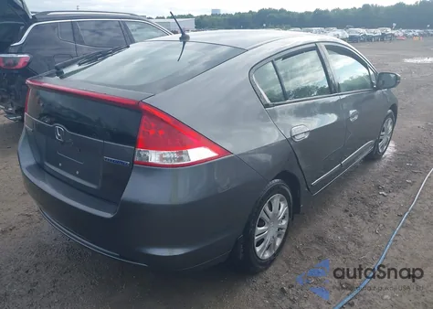 2011 Honda Insight from USA, damaged, VIN JHMZE2H34BS005548